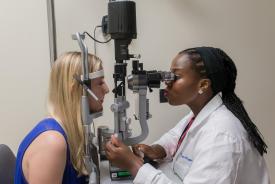 image tagged with check-up, slit lamp, provider, women, medical care, …;