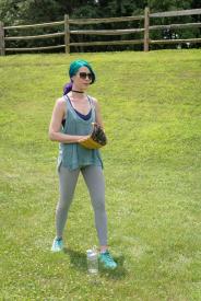 image tagged with woman, field, throwing, gym clothes, sunglasses, …;