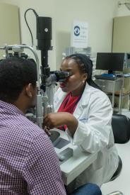 image tagged with medical care, african-american, eye exam, male, vision exam, …;