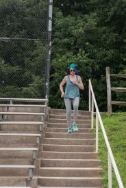 image tagged with bleachers, climbs, female, walking, sneakers, …;