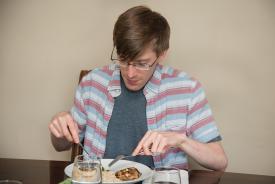 image tagged with fork, male, sitting, healthy food, glasses, …;