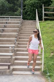 image tagged with gym clothes, woman, glasses, stairs, latinx, …;