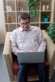 image tagged with sit, man, caucasian, sitting, laptop, …;