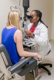 image tagged with women, patient, african-american, check-up, eye exam, …;