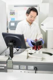 image tagged with asian-american, holding, science, lab, computer, …;