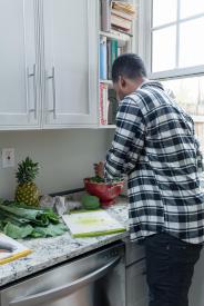 image tagged with cutting board, cooking, man, home, greens, …;