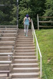 image tagged with goes, stairs, park, young, woman, …;