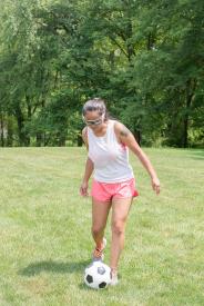 image tagged with safety glasses, female, glasses, asian-american, kicking, …;