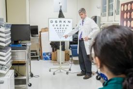image tagged with female, vision exam, doctor's office, male, lady, …;