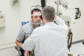 image tagged with exam room, caucasian, eye exam, men, medical care, …;