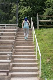 image tagged with tennis shoes, climb, bleachers, walks, going, …;