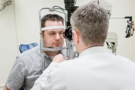 image tagged with middle aged, eye exam, men, doctor, exam room, …;