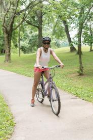 image tagged with biking, woman, bicycle, young, exercising, …;
