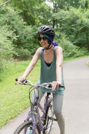 image tagged with trail, lady, caucasian, smiles, bicycle, …;