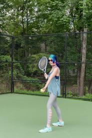 image tagged with woman, ball, serves, sunglasses, plays, …;