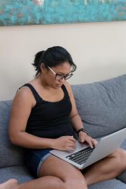 image tagged with asian-american, girl, female, couch, computer, …;