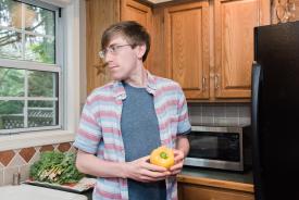 image tagged with kitchen, man, stands, millennial, glasses, …;