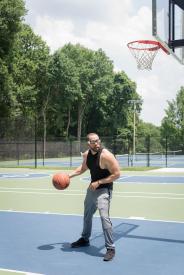 image tagged with outdoors, glasses, dribble, sneakers, court, …;