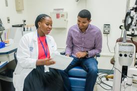 image tagged with woman, guy, african-american, doctor's office, talking, …;