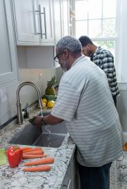 image tagged with glasses, african-american, food prep, home, wash, …;