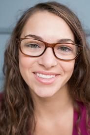 image tagged with closeup, female, millennial, glasses, smiling, …;