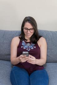 image tagged with looking, look, couch, glasses, woman, …;
