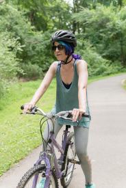 image tagged with physical activity, woman, park, ride, helmet, …;
