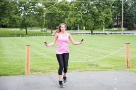 image tagged with gym clothes, jump-rope, field, jumps, shoes, …;