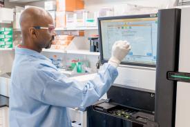 image tagged with african-american, male, glasses, gloves, laboratory, …;