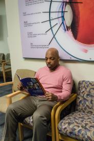 image tagged with sit, doctor's office, african-american, sitting, guy, …;