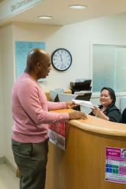 image tagged with african-american, help, smiling, doctor's office, paper, …;
