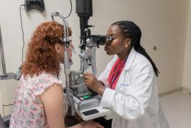 image tagged with slit lamp, medical device, women, caucasian, provider, …;