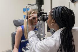 image tagged with exam room, slit lamp, african-american, medical device, girls, …;