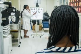 image tagged with women, patient, african-american, females, vision exam, …;