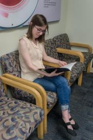 image tagged with girl, lobby, doctor's appointment, booklet, woman, …;