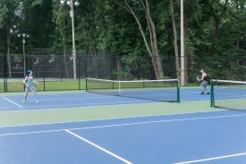 image tagged with serve, serving, ball, racket, park, …;