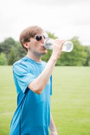image tagged with man, drink, water, holding, outside, …;