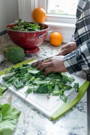 image tagged with leafy greens, cutting board, inside, fruits, hands, …;