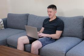 image tagged with sits, boy, laptop, sit, man, …;