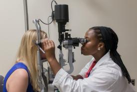 image tagged with doctor's office, females, slit lamp, girls, check-up, …;