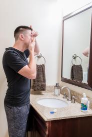 image tagged with eye drops, man, mirror, cap, case, …;