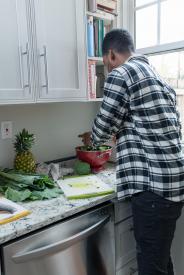 image tagged with cutting board, food, fruits, greens, man, …;
